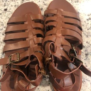 Brown Roman style sandals.